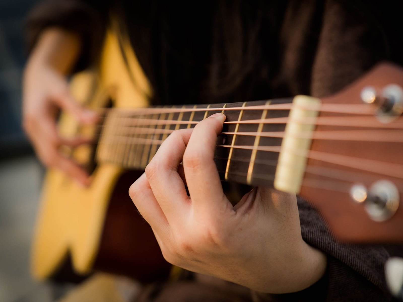 Detailed shot of guitar fret polishing for optimal playability